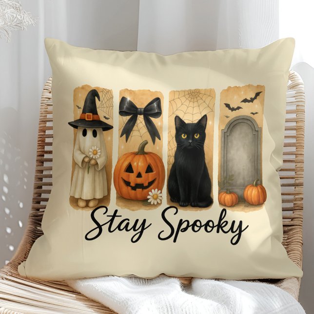"Stay Spooky" Halloween Brush Stroke Cat Throw Pillow ("Stay Spooky" Halloween Brush Stroke Cat Throw Pillow on a sunny boho rattan chair.)