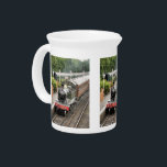 STEAM TRAINS BEVERAGE PITCHER<br><div class="desc">A beautifully restored steam train and carriages of a bygone era arriving at the train station.</div>
