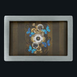 Steampunk Gears and Blue Butterflies Belt Buckle<br><div class="desc">Composition of round steampunk clock with black Roman numeral dial,  decorated with gold and brass gears,  blue Morpho butterflies and damaged lenses on brown striped background. Steampunk style.</div>