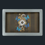 Steampunk Gears and Blue Butterflies Belt Buckle<br><div class="desc">Composition of round steampunk clock with black Roman numeral dial,  decorated with gold and brass gears,  blue Morpho butterflies and damaged lenses on brown striped background. Steampunk style.</div>