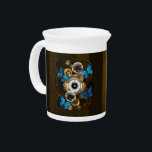 Steampunk Gears and Blue Butterflies Beverage Pitcher<br><div class="desc">Composition of round steampunk clock with black Roman numeral dial,  decorated with gold and brass gears,  blue Morpho butterflies and damaged lenses on brown striped background. Steampunk style.</div>