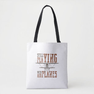 still fly playing with airplanes tote bag