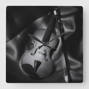 Still-life b&W image of a violin Square Wall Clock