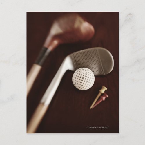Still life if vintage golf clubs tees and ball postcard