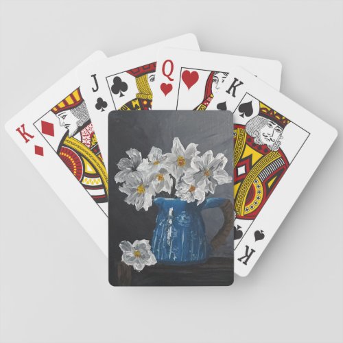 Still life white flowers in a blue pitcher playing cards