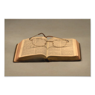 Still life with open bible and reading glasses photo print