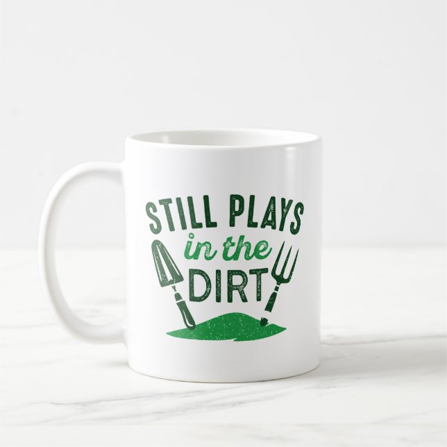 Still Plays In The Dirt Coffee Mug (Left)