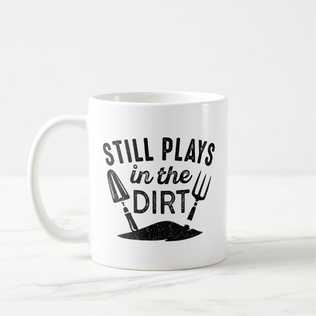 Still Plays In The Dirt Coffee Mug (Left)
