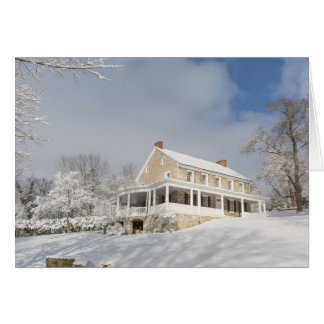 Stone mansion in snow and sunlight cards