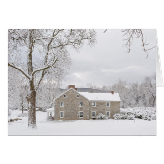 Stone mansion in snow with hills cards