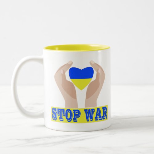 Stop war Ukrainian flag heart in hands  Two_Tone Coffee Mug