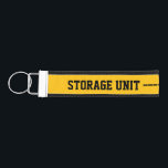 Storage Unit Wrist Keychain<br><div class="desc">Stay organized in style with this bold storage unit wrist keychain, designed to keep your keys secure and easy to find. Featuring a striking yellow and black graphic with an unlocked padlock, this eye-catching accessory combines function with modern design. Easily customize the text to suit your needs—perfect for storage units,...</div>