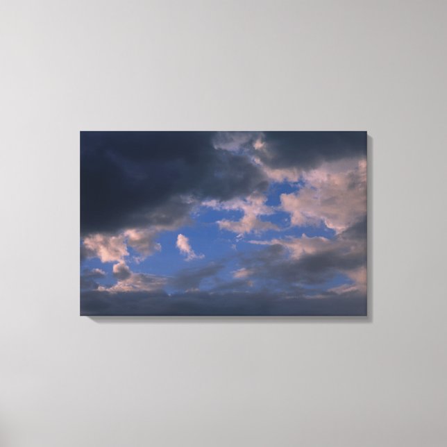 Storm clouds against blue sky canvas print (Front)