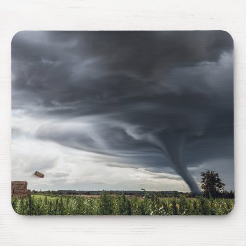 Storm tornado or twister lifing hay in bad weather mouse pad