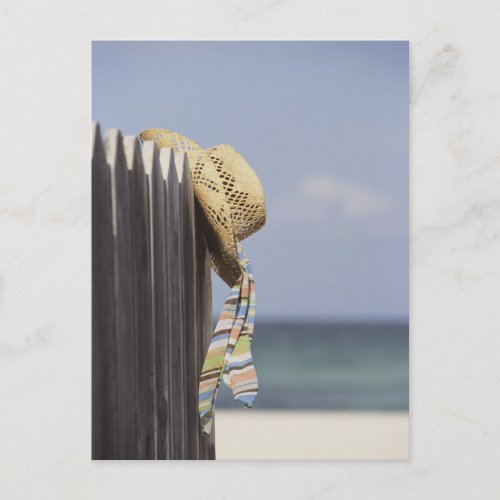 Straw Hat Hanging On Fence At Beach Postcard