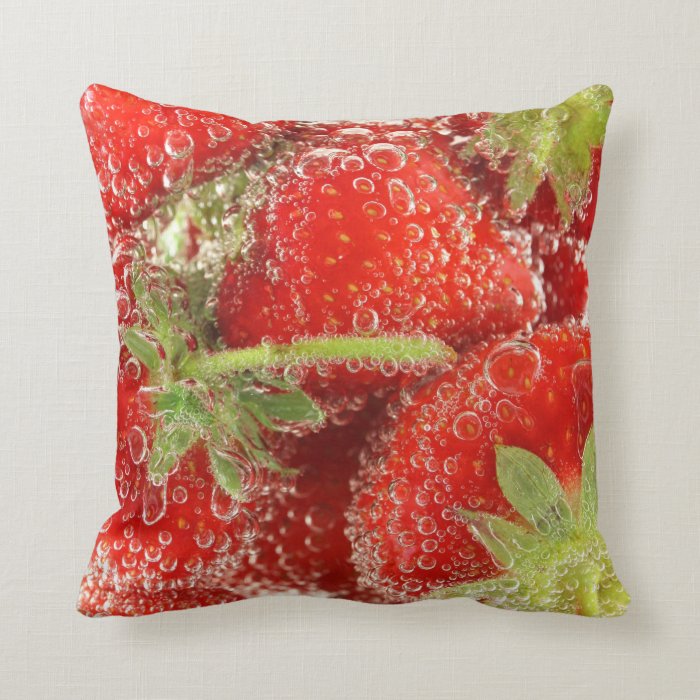 Strawberries being washed macro throw pillow