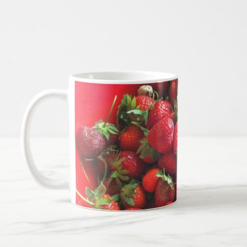 Strawberries  fresh picked red berries    coffee mug