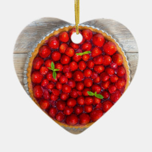 Strawberry cake with mint leaves on a rustic wood ceramic ornament