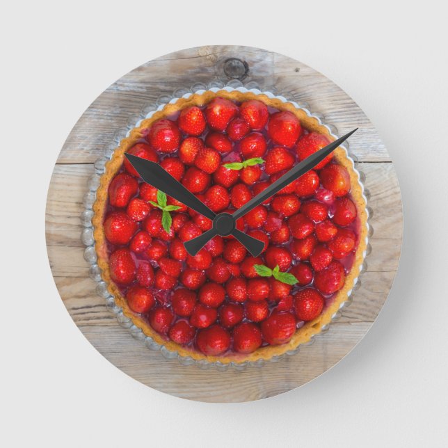 Strawberry cake with mint leaves on a rustic wood round clock (Front)