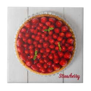 Strawberry cake with mint on white wood ceramic tile