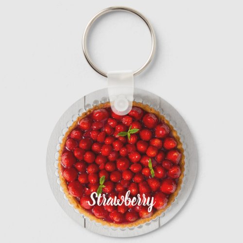 Strawberry cake with mint on white wood keychain