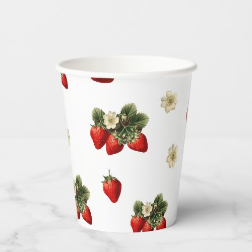 Strawberry paper cups with blossoms on white