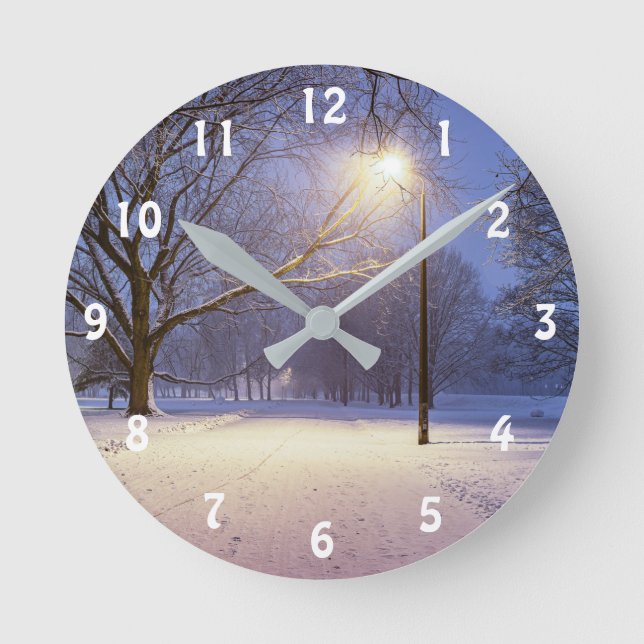 Street lights and covered in snow trees round clock (Front)
