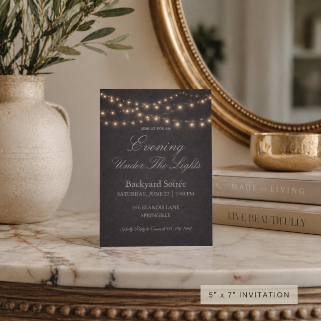 String Light Gathering Invitation (String lights glow over a charcoal evening setting for a refined backyard gathering)