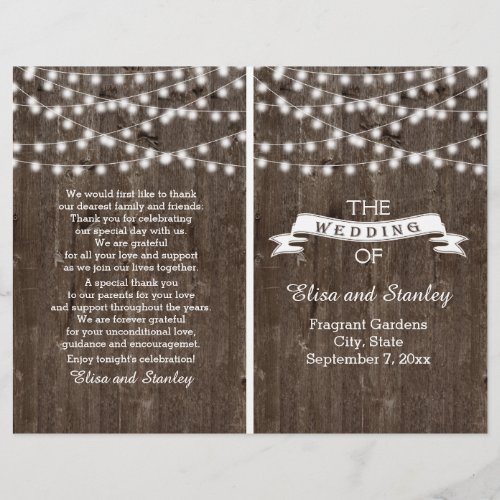 String lights on old wood folded wedding program