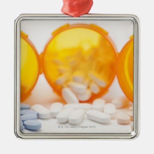 Studio shot of medicine bottle with pills metal ornament