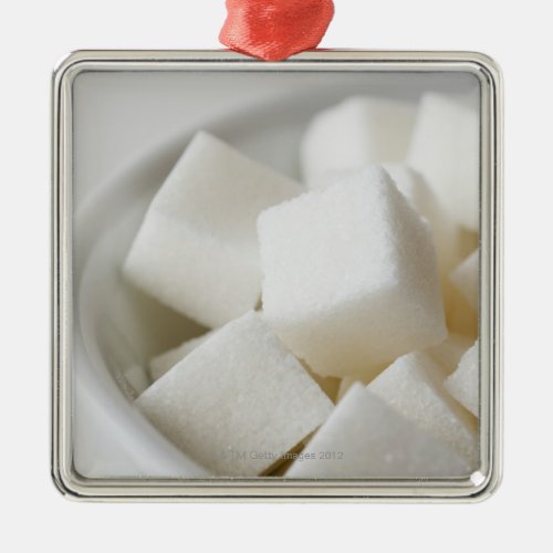 Studio shot of sugar cubes in bowl metal ornament