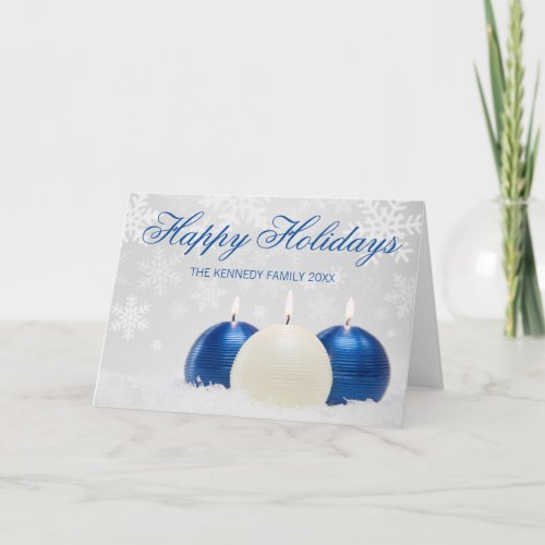 Studio shot of three candles with snow flakes holiday card
