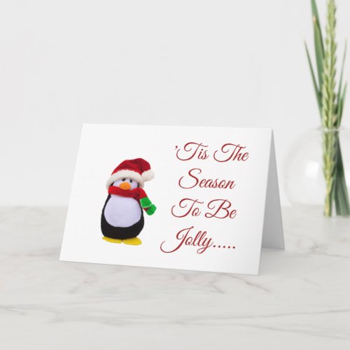 Stuffed toy penguin dressed for winter card