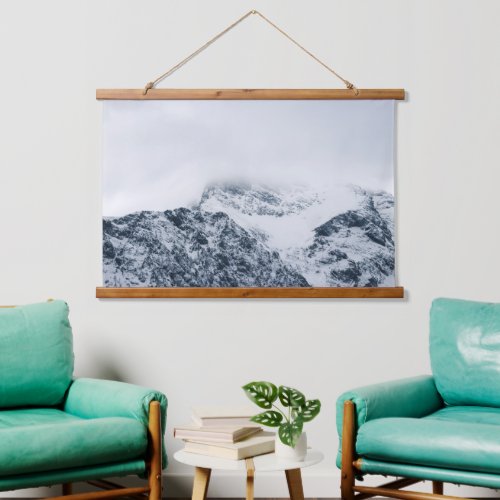 Stunning snowy mountains covered by clouds hanging tapestry