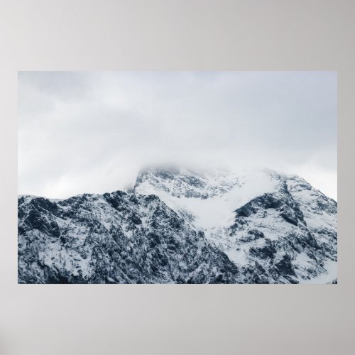 Stunning snowy mountains covered by clouds poster