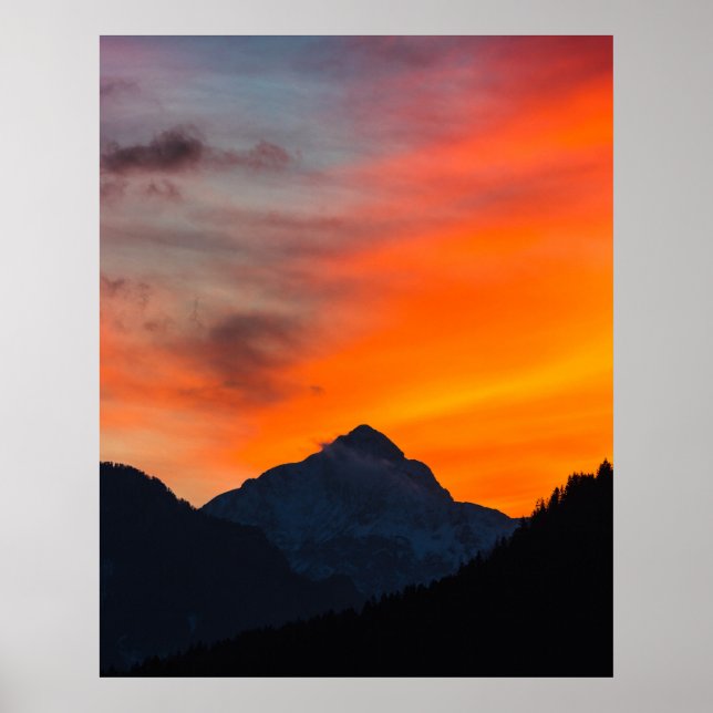 Stunning vibrant sunset behind mountain poster (Front)