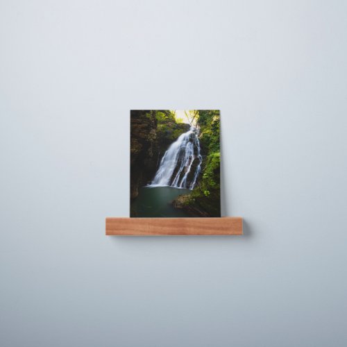 Stunning waterfall with sunlight glow picture ledge