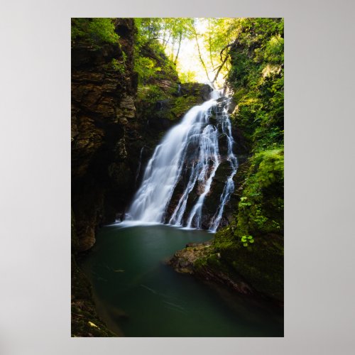 Stunning waterfall with sunlight glow poster