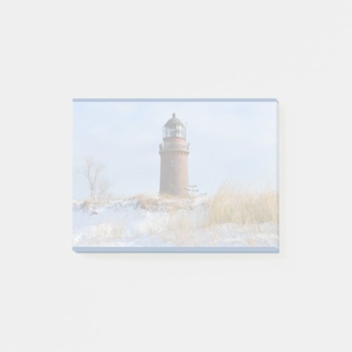 Sturdy Lighthouse on a Rocky Coast in Winter Post_it Notes