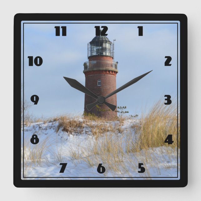 Sturdy Lighthouse on a Rocky Coast in Winter Square Wall Clock (Front)