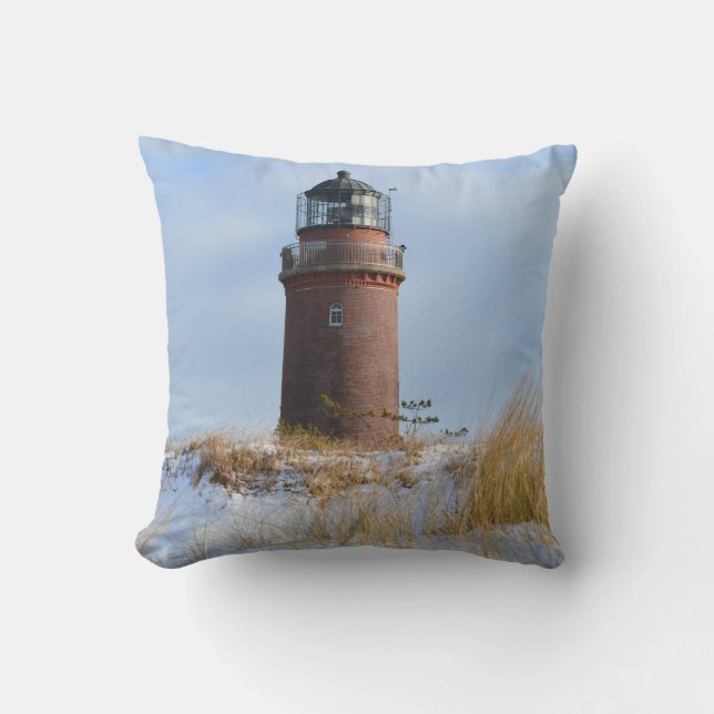 Sturdy Lighthouse on a Rocky Coast in Winter Throw Pillow (Front)