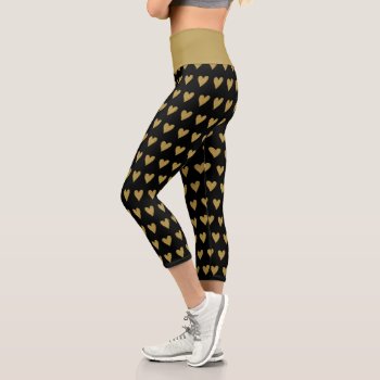 Stylish Black And Gold Heart Pattern Capri Leggings by InTrendPatterns at Zazzle