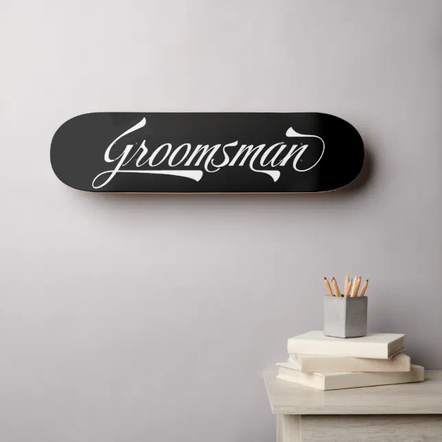 Black wall-mounted skateboard deck with groomsman in white text.
