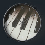 Stylish Black & White Piano Keys Photograph Clock<br><div class="desc">A clock with a musical themed photograph featuring up close image of piano keys. Stylish and elegant.</div>