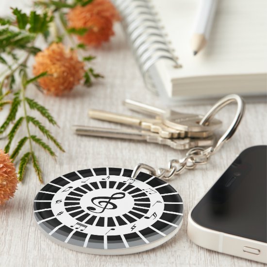 Stylish circular black white musical notes design keychain