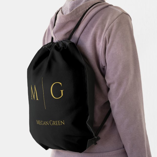 Stylish black drawstring bag with gold monogram and personalized name