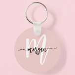 Stylish Pink Modern Script Girly Monogram Name Keychain<br><div class="desc">Elevate your everyday essentials with the Stylish Pink Modern Script Girly Monogram Name Keychain. This elegant accessory showcases a blush pink background with a delicate monogram in modern script, adding a personal touch to your keys. Made from high-quality materials, this keychain is both durable and fashionable, making it a perfect...</div>