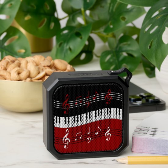 stylish red white black piano keys and notes bluetooth speaker