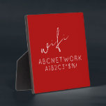 Stylish Red WiFi Password Sign Plaque<br><div class="desc">Keep your guests connected with this stylish WiFi password sign plaque. Featuring a bold red background and clean modern typography, this plaque is the perfect addition to any home or office. The 5.25x5.25 size and included easel make it easy to display in any room. Simply fill in your WiFi password...</div>