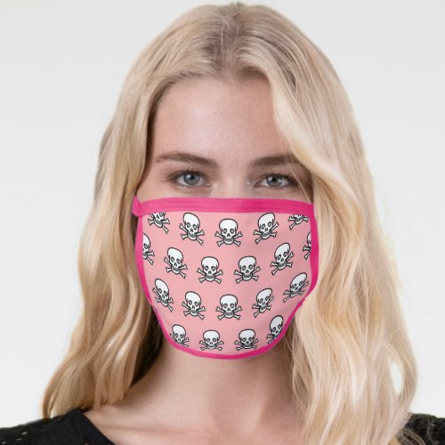 Stylish skull and bones pattern on coral pink face mask